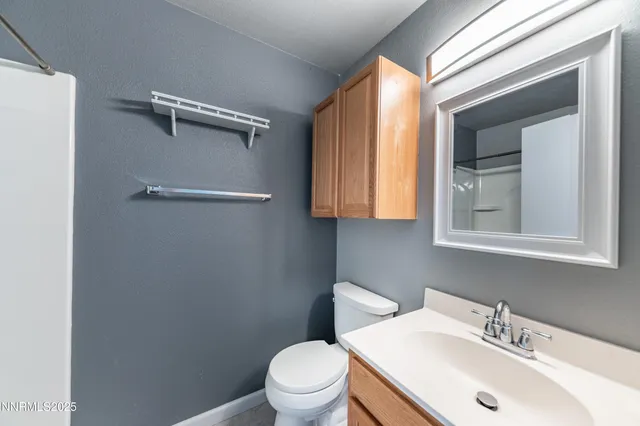 an empty room with a empty space and a ceiling fan