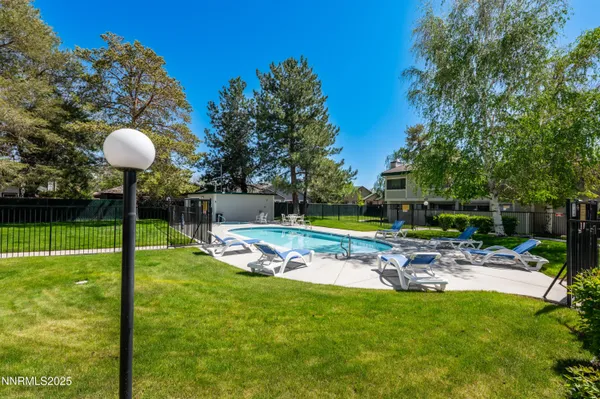 a view of a swimming pool with a patio