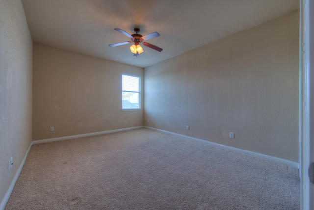 321 Limestone Trail Austin, TX 78737 - Photo 25 of 28 a view of an empty room with a chandelier fan
