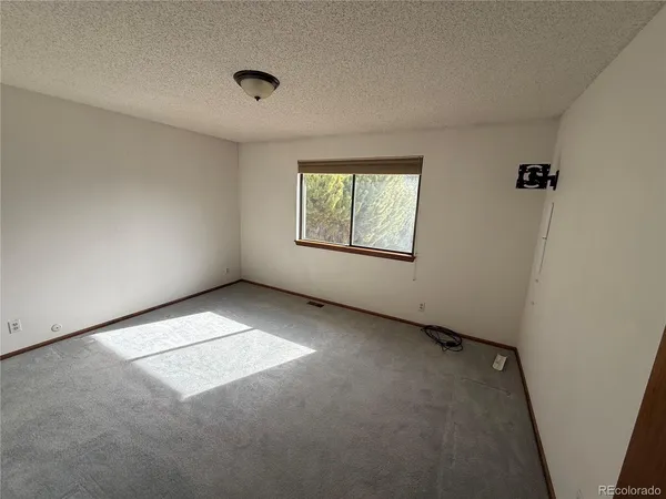 a bathroom with a shower and toilet