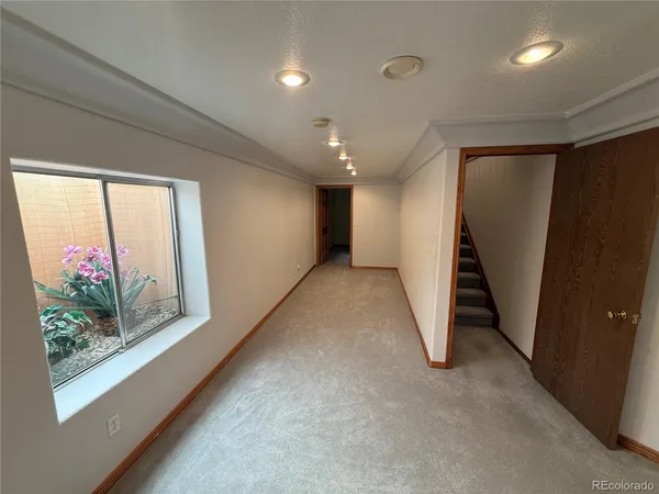 a view of a livingroom with wooden floor and a small space