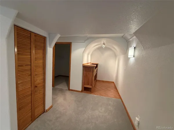 a bathroom with a granite countertop shower and a toilet