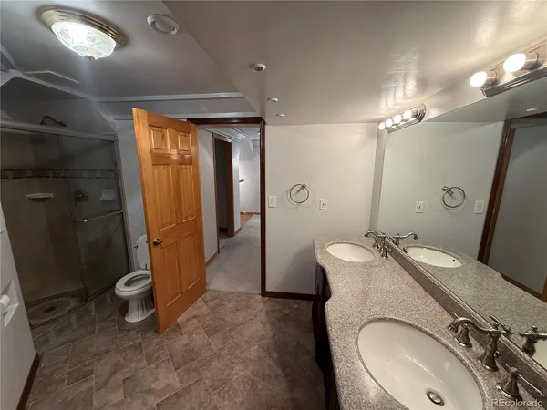 a view of a livingroom with wooden floor and window