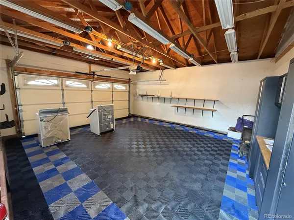 a bed sitting in a room next to a window