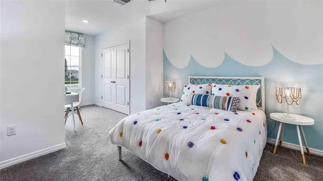 a large white bed in a white room