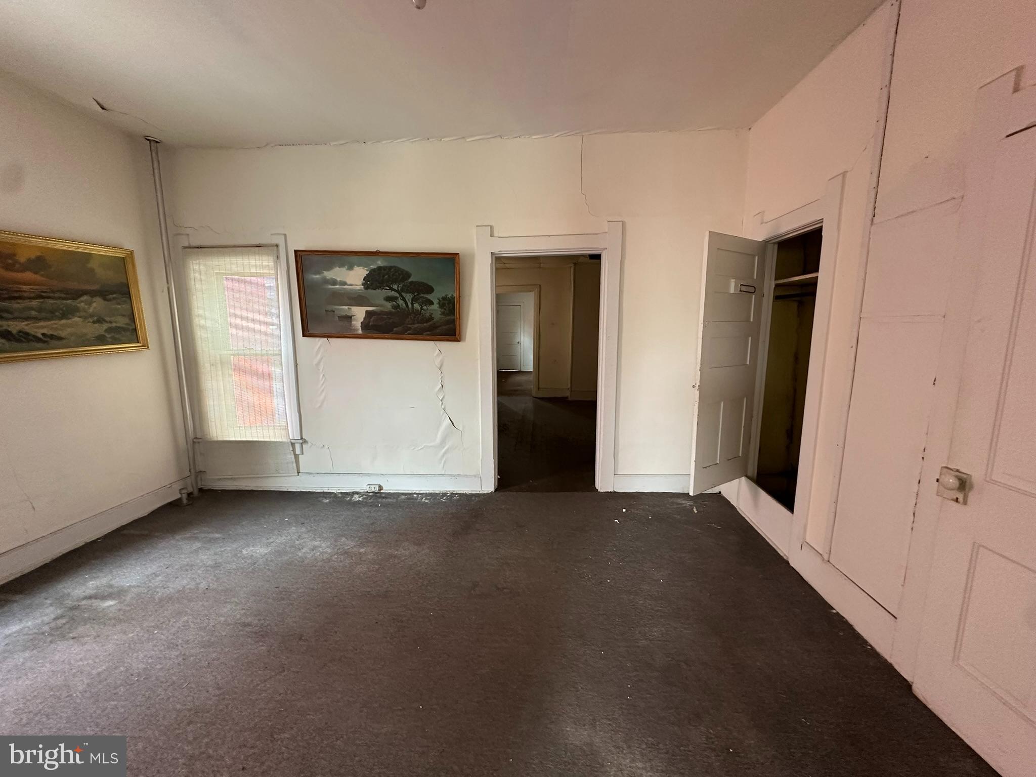 513-515 Penn Street Huntingdon, PA 16652 - Photo 12 of 23 a view of a livingroom with an empty space and a window