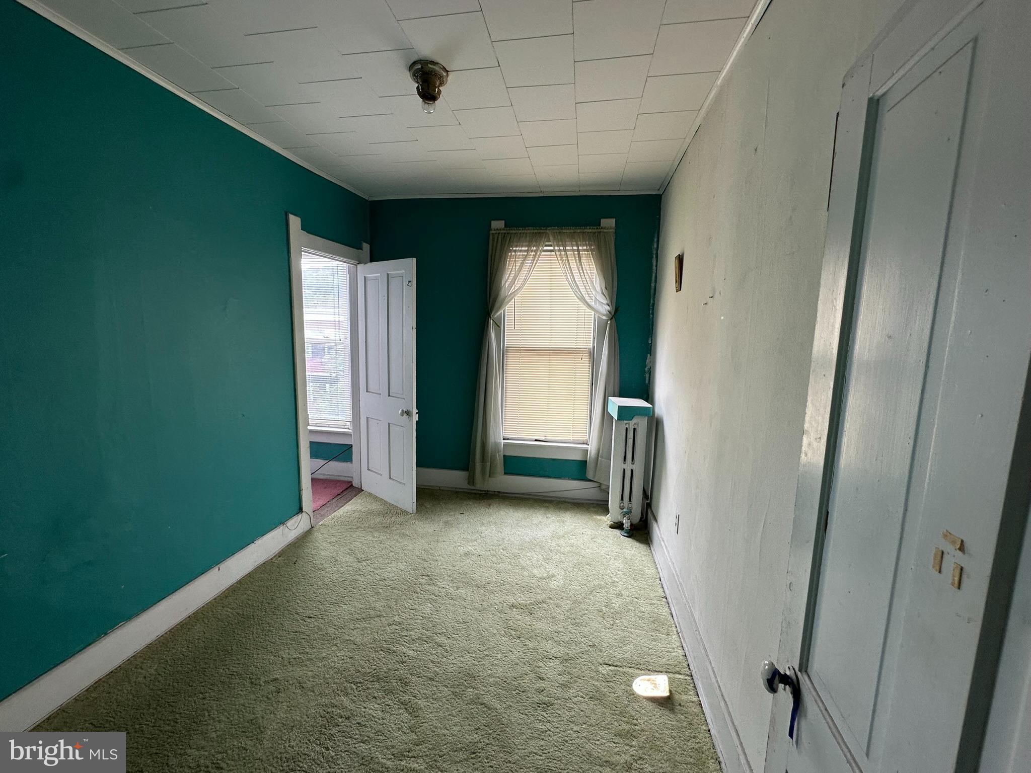 513-515 Penn Street Huntingdon, PA 16652 - Photo 5 of 23 an empty room with windows