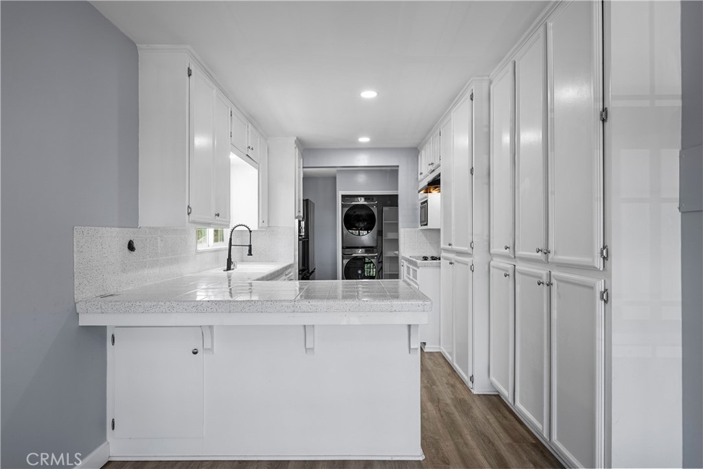 25083 Wheeler Road Newhall, CA 91321 - Photo 11 of 46 a view of kitchen with cabinets and refrigerator