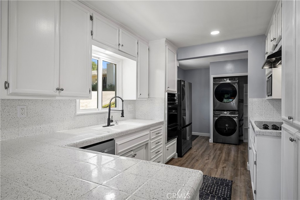 25083 Wheeler Road Newhall, CA 91321 - Photo 12 of 46 a view of a kitchen with refrigerator and windows