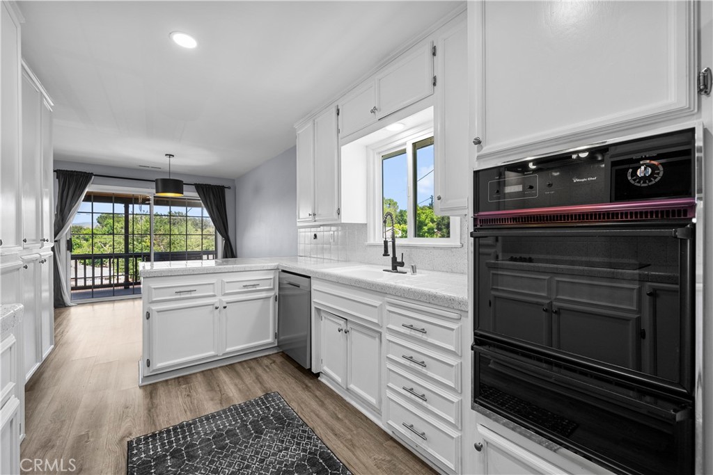 25083 Wheeler Road Newhall, CA 91321 - Photo 15 of 46 a kitchen with a stove oven and sink