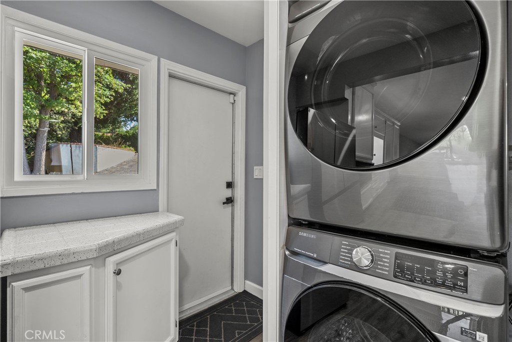 25083 Wheeler Road Newhall, CA 91321 - Photo 16 of 46 a view of washer and dryer in a utility room