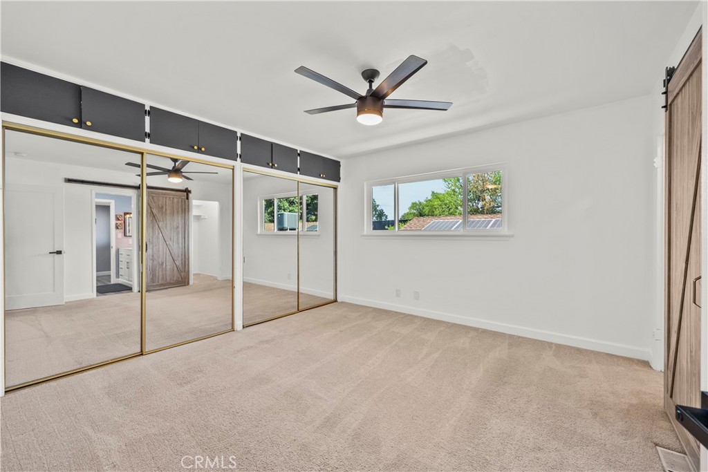 25083 Wheeler Road Newhall, CA 91321 - Photo 17 of 46 a view of a livingroom with a ceiling fan and window