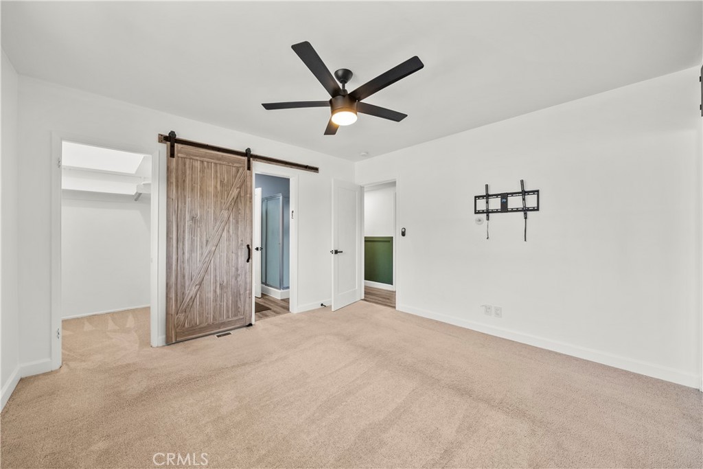 25083 Wheeler Road Newhall, CA 91321 - Photo 18 of 46 a view of a livingroom with a ceiling fan and a ceiling fan