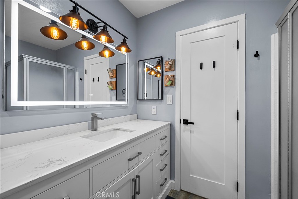 25083 Wheeler Road Newhall, CA 91321 - Photo 19 of 46 a bathroom with a sink and a mirror