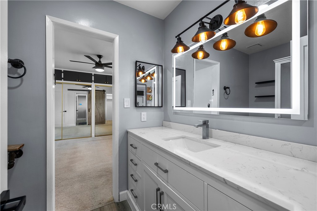 25083 Wheeler Road Newhall, CA 91321 - Photo 20 of 46 a bathroom with a sink and a mirror