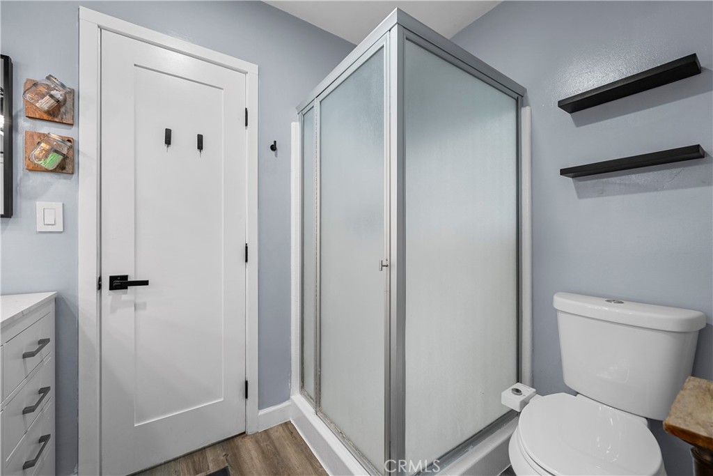 25083 Wheeler Road Newhall, CA 91321 - Photo 21 of 46 a white toilet sitting next to a bathroom