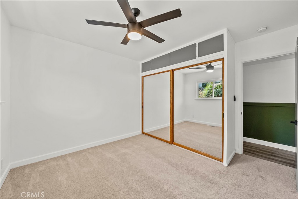 25083 Wheeler Road Newhall, CA 91321 - Photo 23 of 46 an empty room with fan and windows