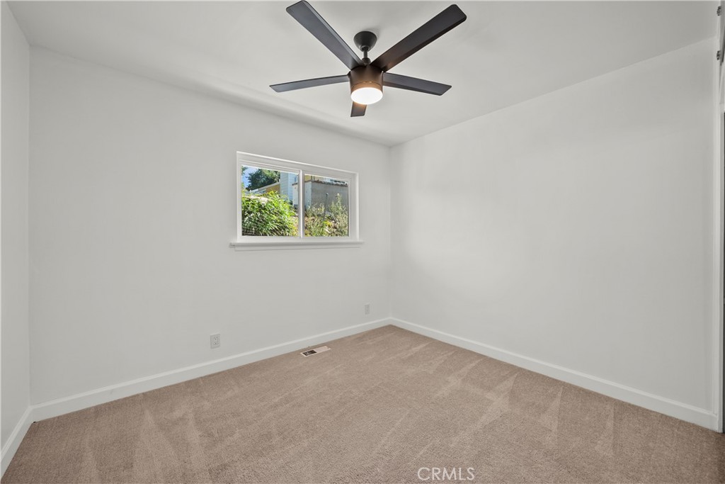 25083 Wheeler Road Newhall, CA 91321 - Photo 26 of 46 an empty room with a window and a ceiling fan