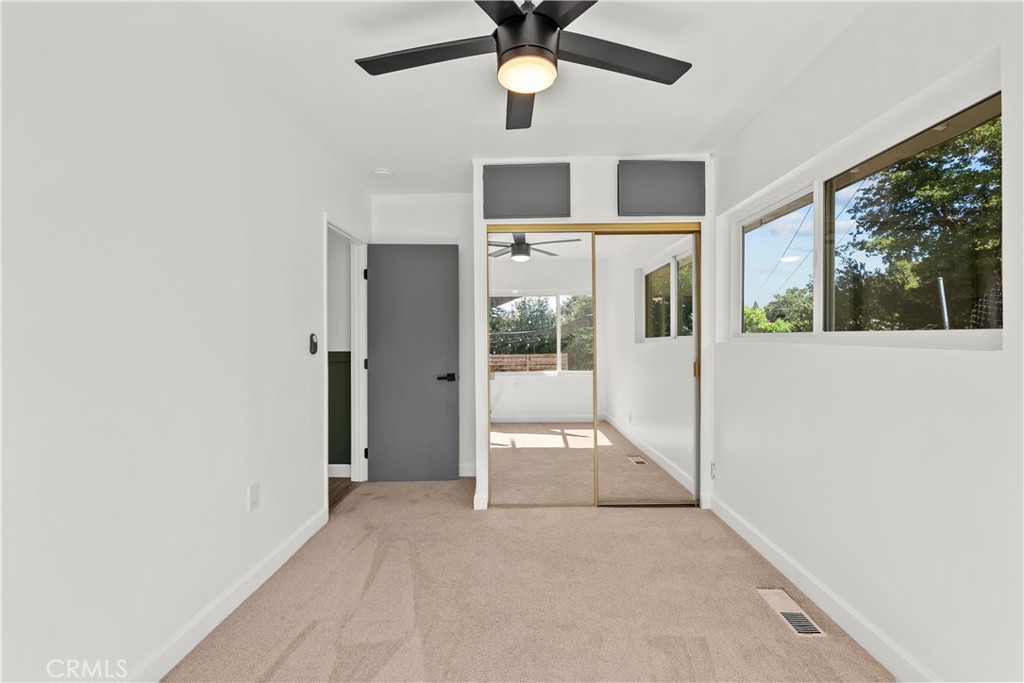 25083 Wheeler Road Newhall, CA 91321 - Photo 27 of 46 a view of a livingroom with a ceiling fan and window