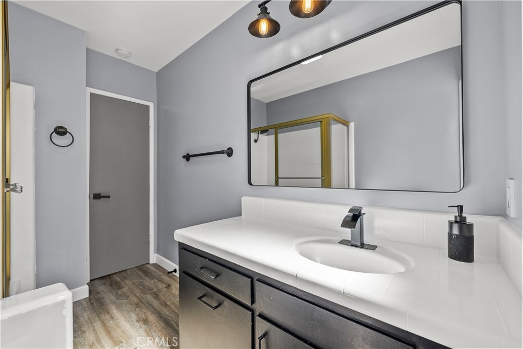 25083 Wheeler Road Newhall, CA 91321 - Photo 32 of 46 a bathroom with a sink and a mirror