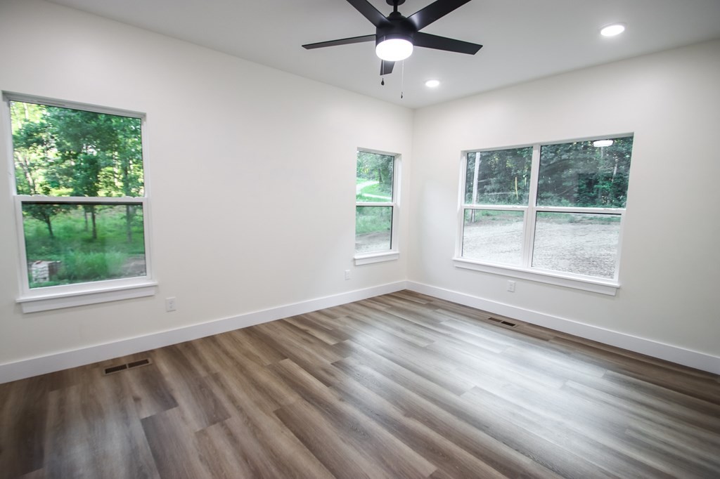 329 Webb Drive Sparta, TN 38583 - Photo 9 of 17 a view of an empty room with wooden floor and a window