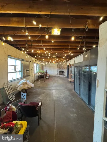 a living room with lots of furniture and a chandelier