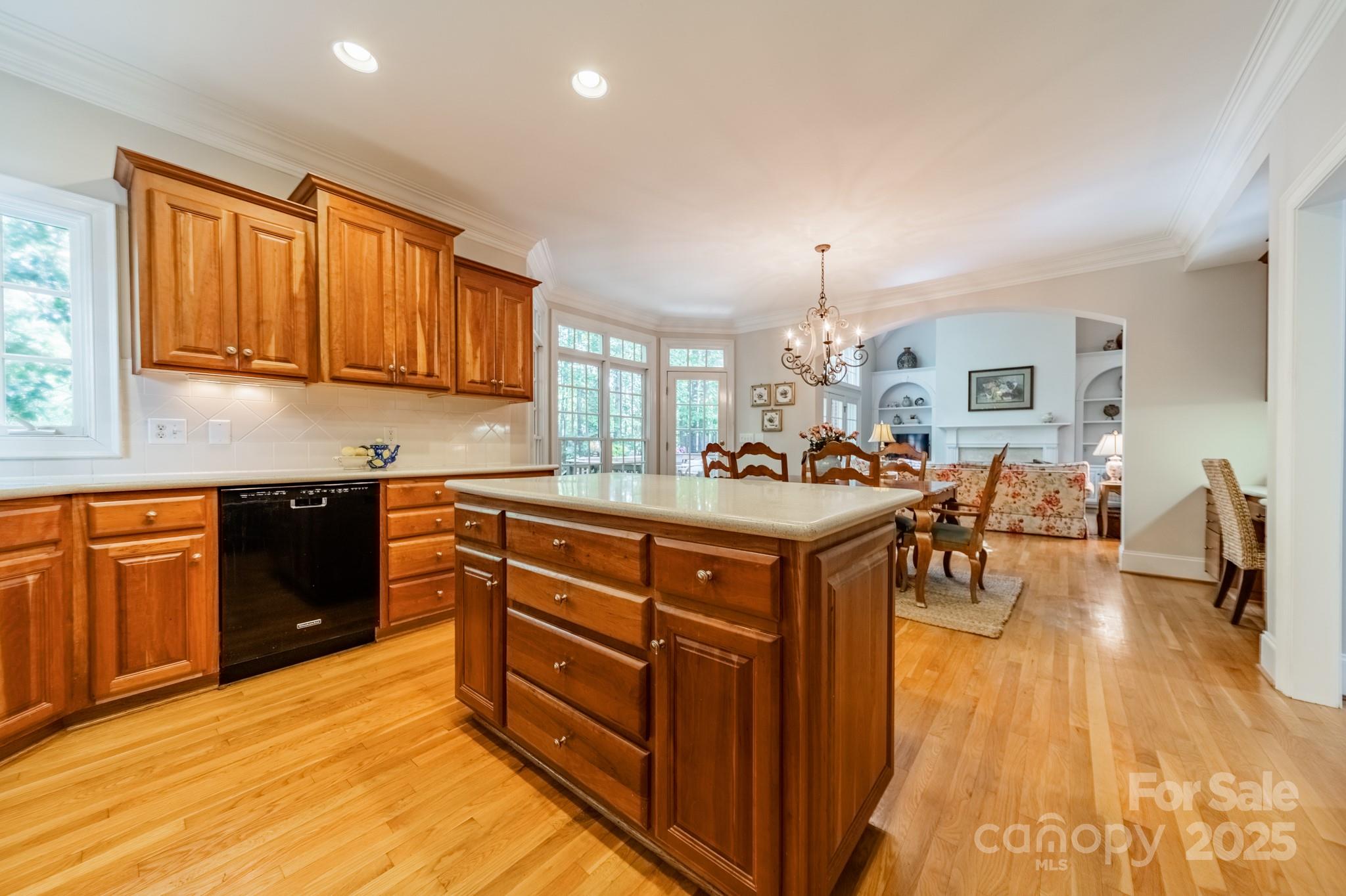4646 Eagle Pointe Court Denver, NC 28037 - Photo 14 of 47 a kitchen with stainless steel appliances granite countertop a sink dishwasher stove and wooden cabinets with wooden floor