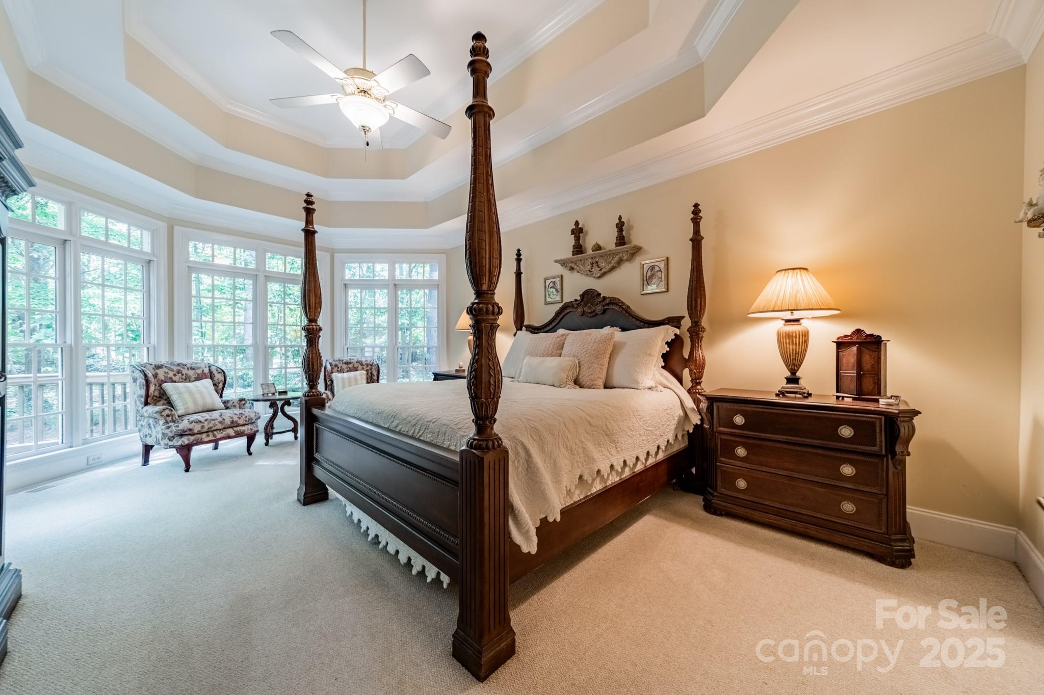 4646 Eagle Pointe Court Denver, NC 28037 - Photo 17 of 47 a spacious bedroom with a bed and a chandelier