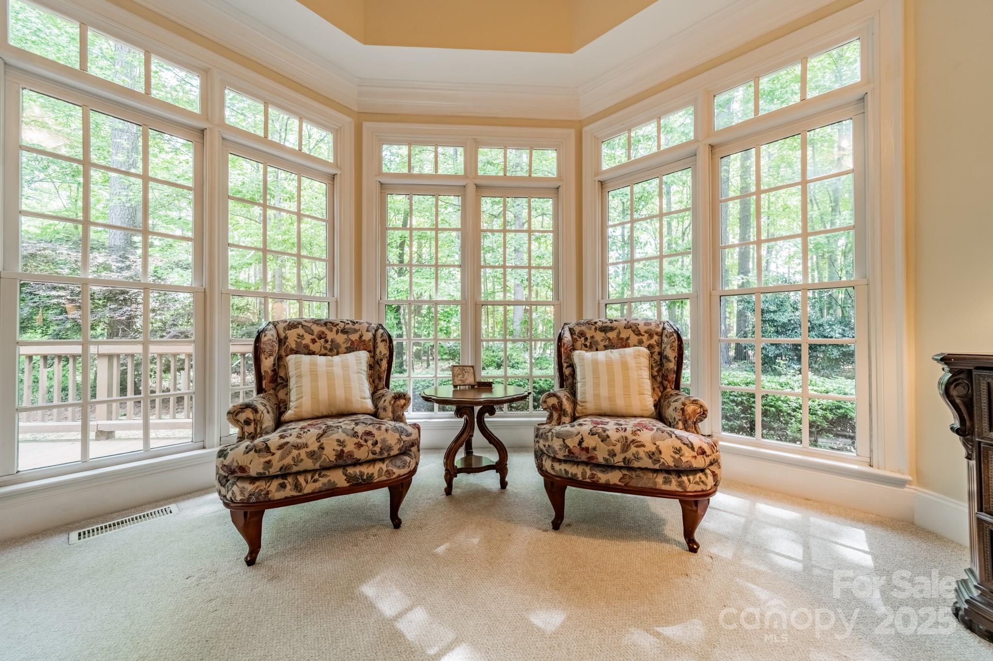 4646 Eagle Pointe Court Denver, NC 28037 - Photo 18 of 47 a living room with furniture and floor to ceiling windows
