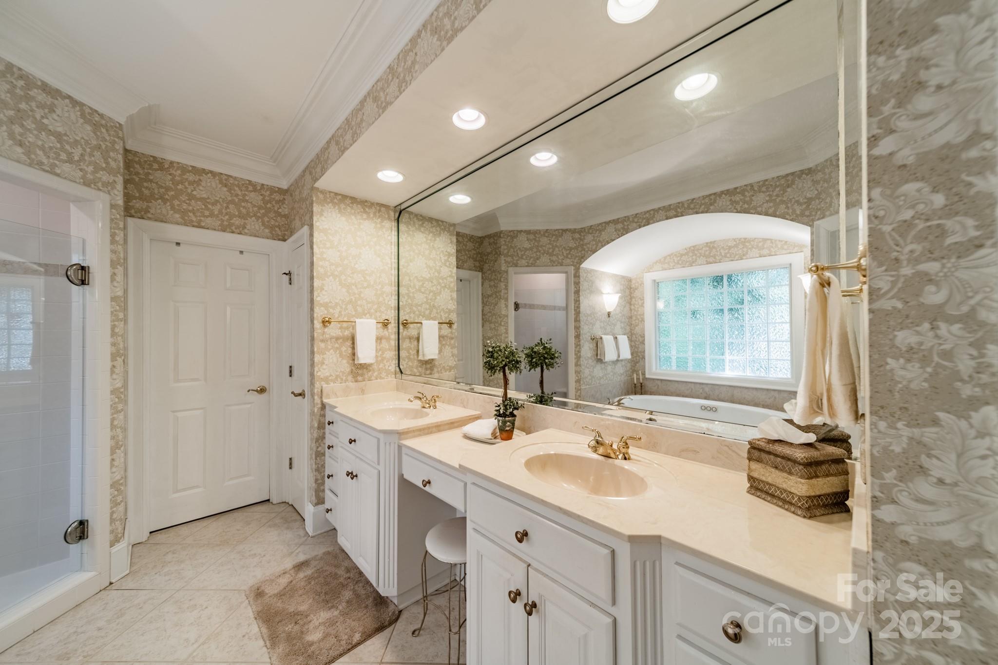 4646 Eagle Pointe Court Denver, NC 28037 - Photo 19 of 47 a spacious bathroom with a double vanity sink a mirror and a shower