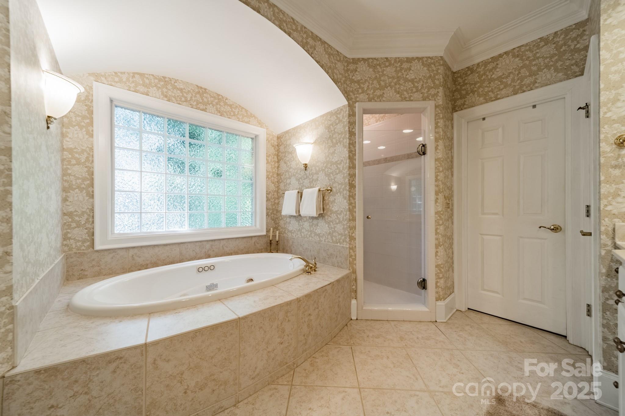 4646 Eagle Pointe Court Denver, NC 28037 - Photo 20 of 47 a bathroom with a tub shower and sink