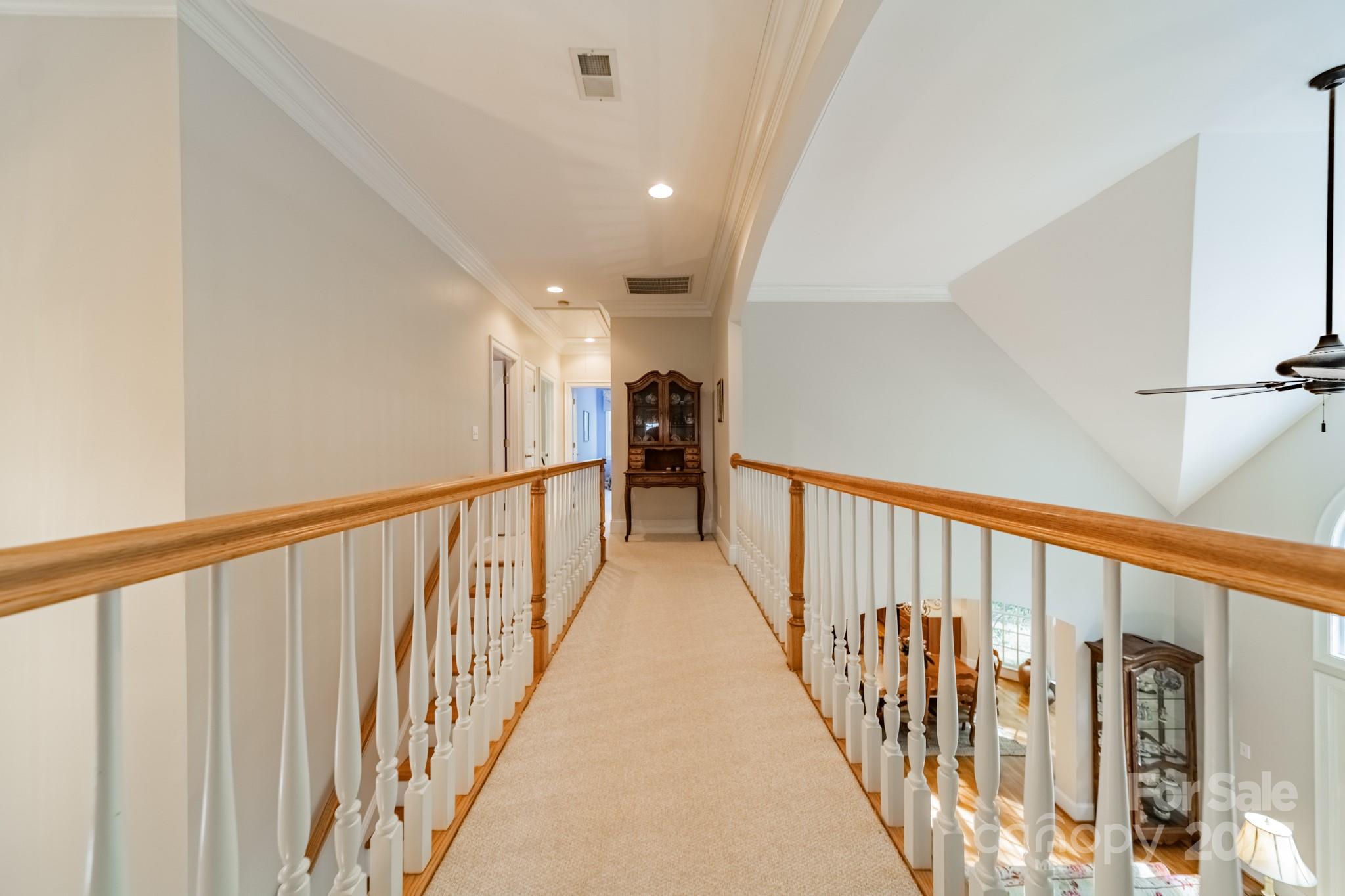 4646 Eagle Pointe Court Denver, NC 28037 - Photo 24 of 47 a view of staircase with lots of frames on wall and a window
