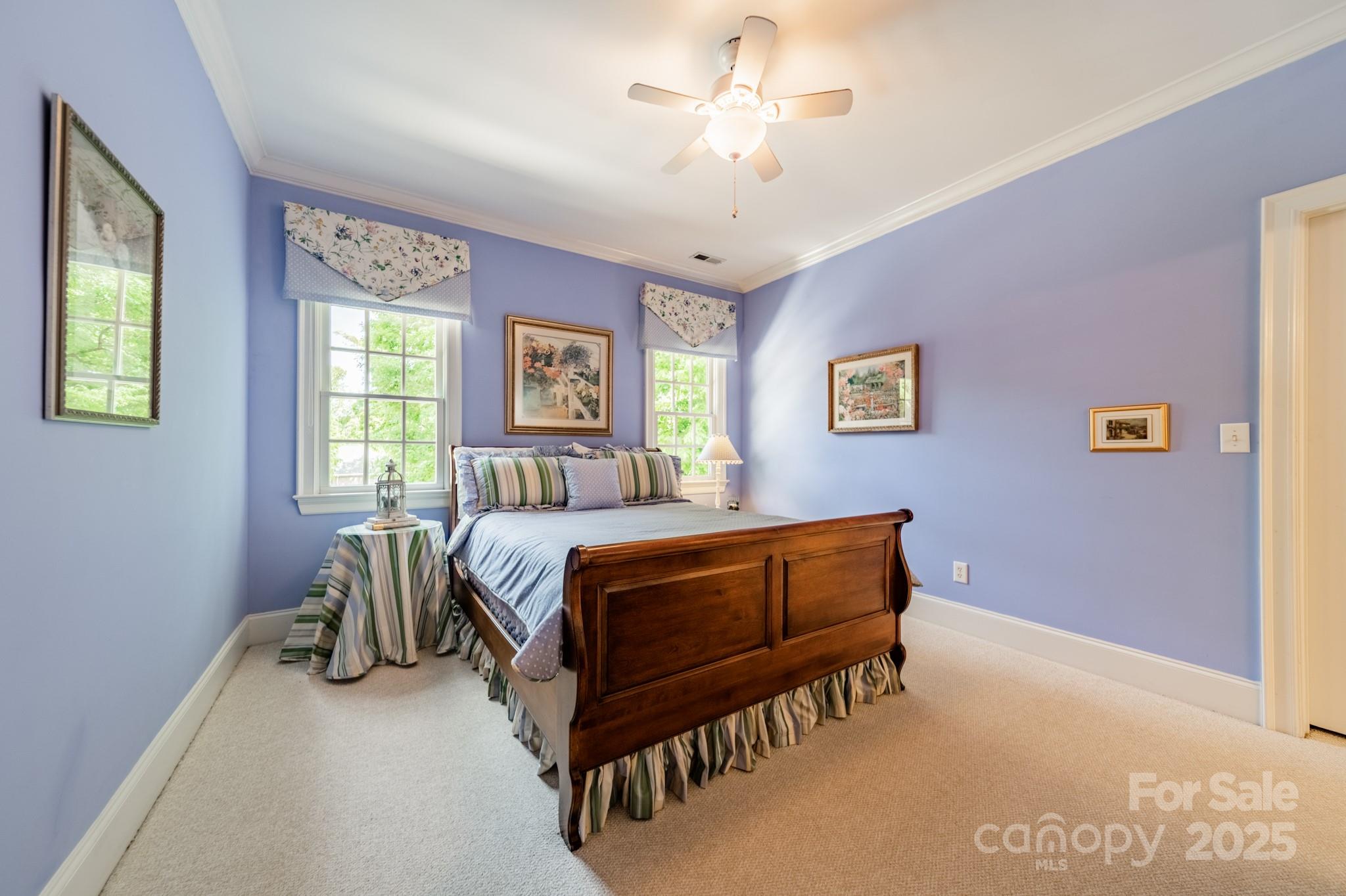 4646 Eagle Pointe Court Denver, NC 28037 - Photo 25 of 47 a bedroom with a bed and a chandelier