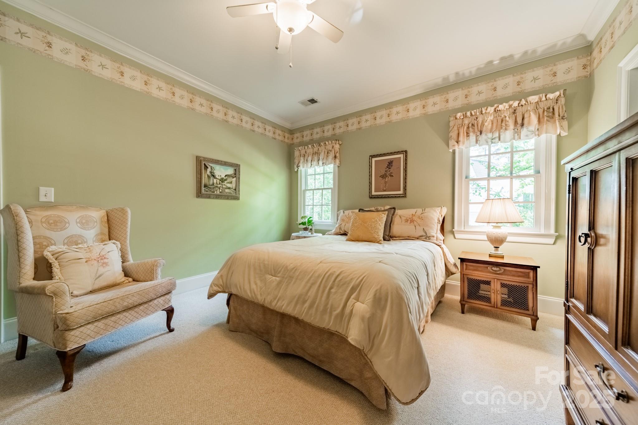 4646 Eagle Pointe Court Denver, NC 28037 - Photo 28 of 47 a spacious bedroom with a bed and a couch