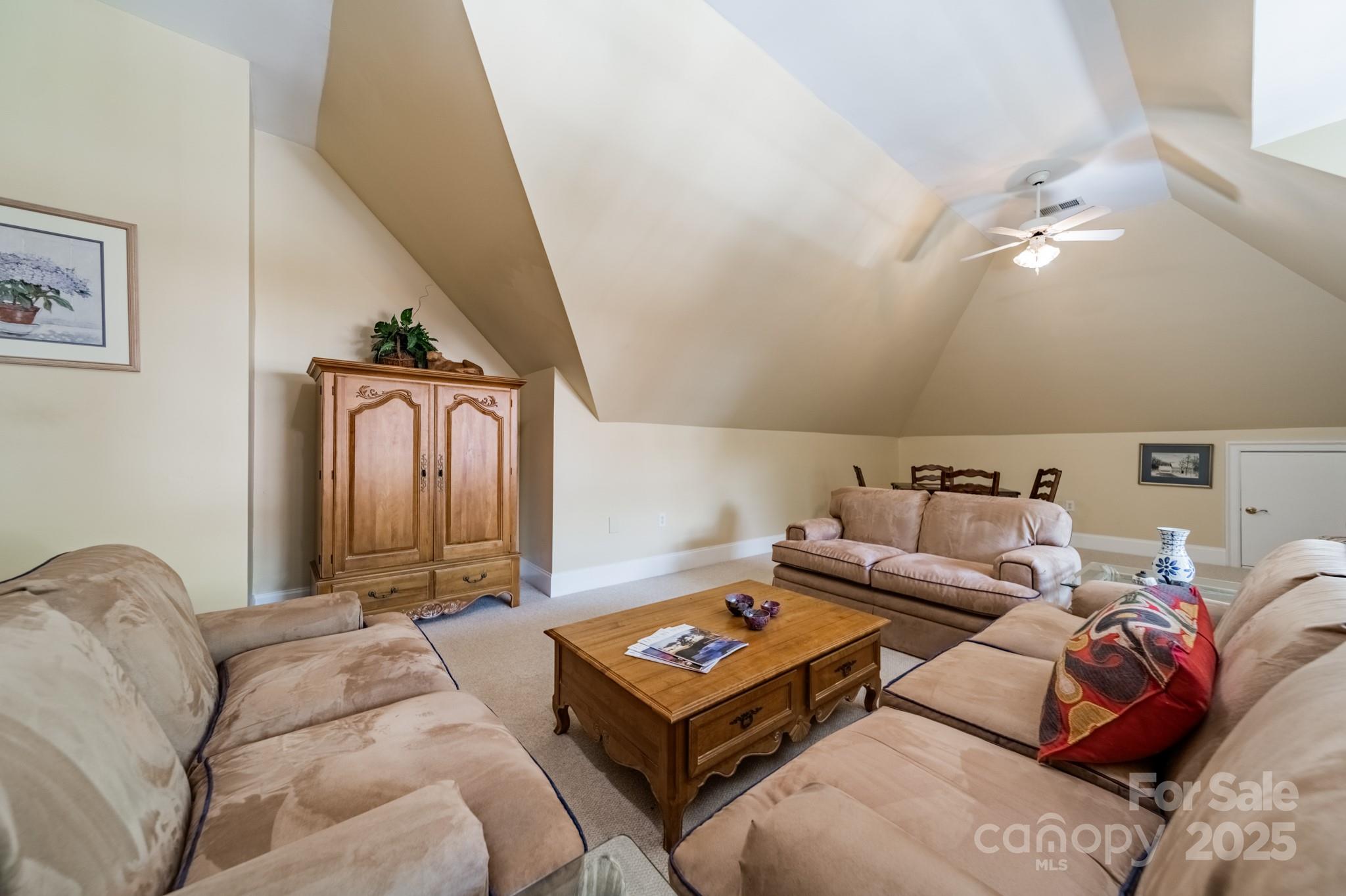 4646 Eagle Pointe Court Denver, NC 28037 - Photo 30 of 47 a living room with furniture and a rug