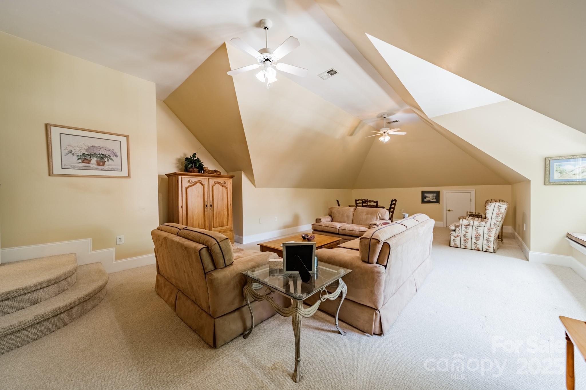 4646 Eagle Pointe Court Denver, NC 28037 - Photo 31 of 47 a living room with furniture and a flat screen tv