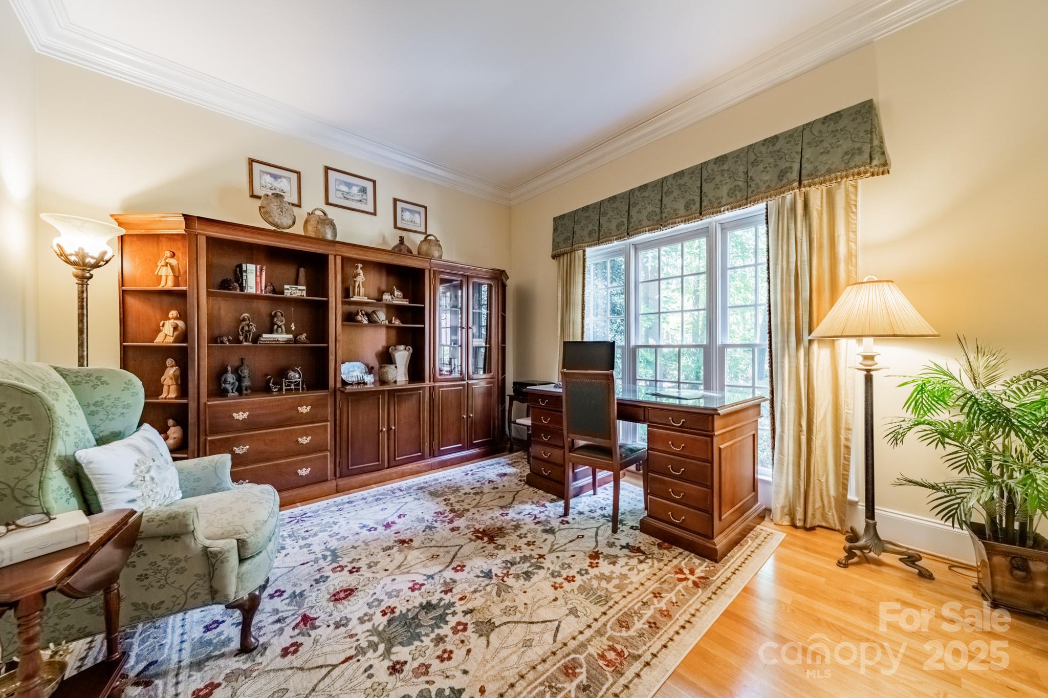 4646 Eagle Pointe Court Denver, NC 28037 - Photo 4 of 47 a living room with furniture cabinets and a flat screen tv