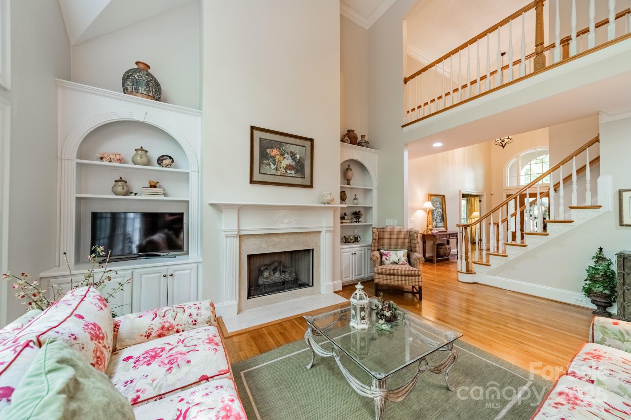 4646 Eagle Pointe Court Denver, NC 28037 - Photo 9 of 47 a living room with furniture and a fireplace