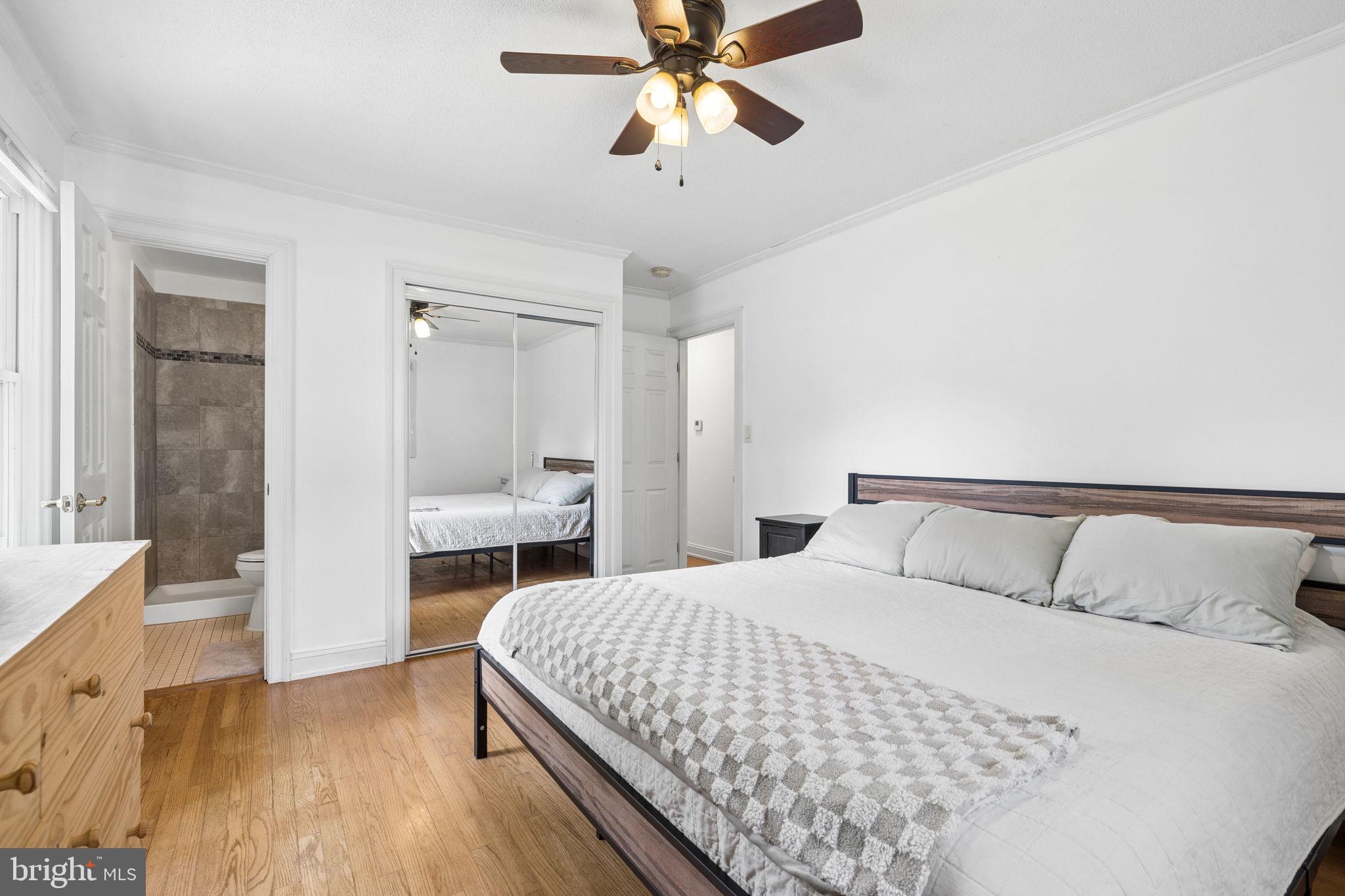 12237 Randle Lane Culpeper, VA 22701 - Photo 12 of 31 a bedroom with a bed and a chandelier