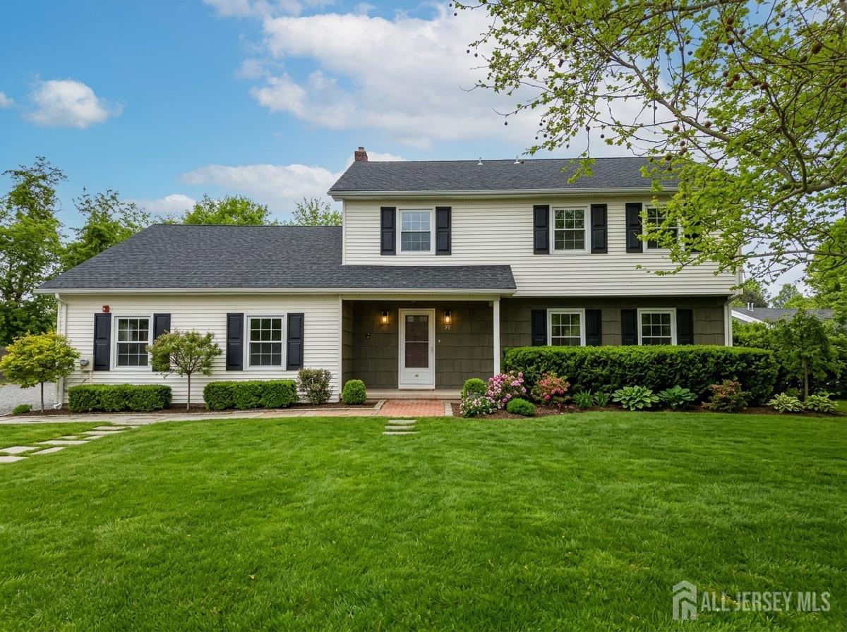 a front view of a house with garden and porch