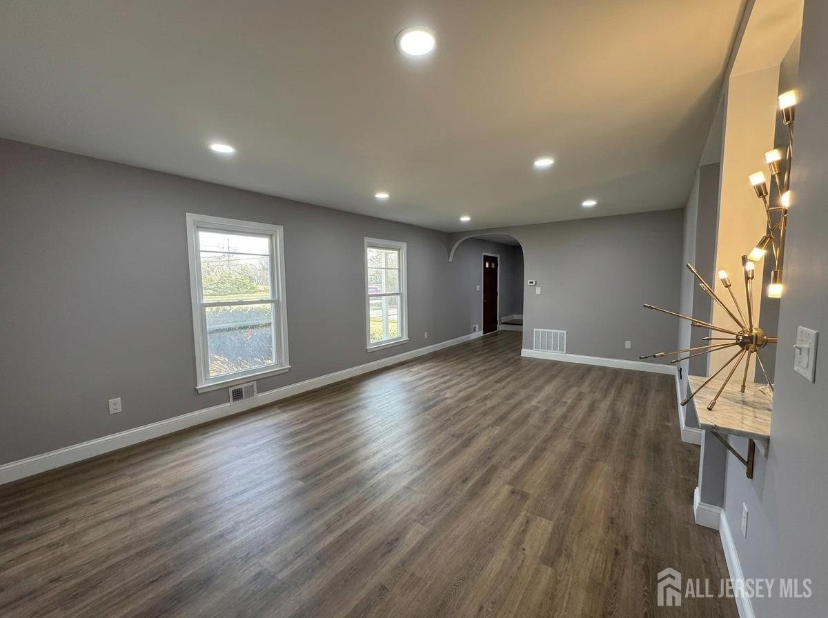 53 North Post Road West Windsor, NJ 08550 - Photo 13 of 36 a view of an empty room with wooden floor and a window