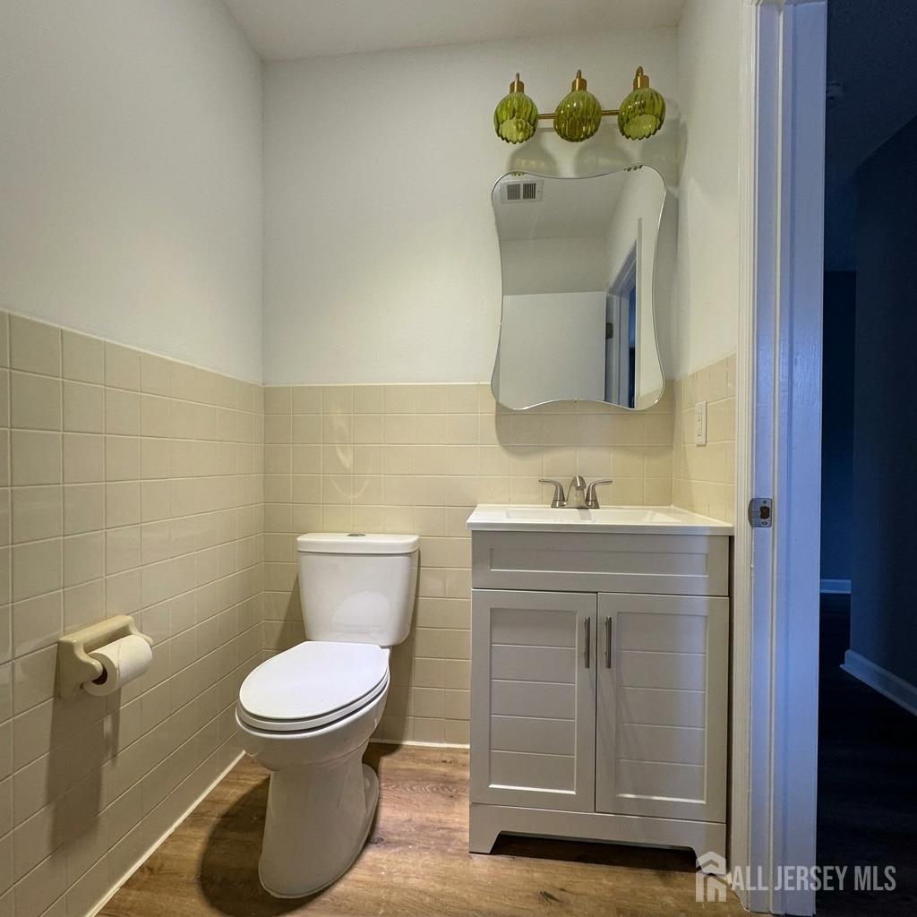 53 North Post Road West Windsor, NJ 08550 - Photo 14 of 36 a bathroom with a toilet sink and mirror