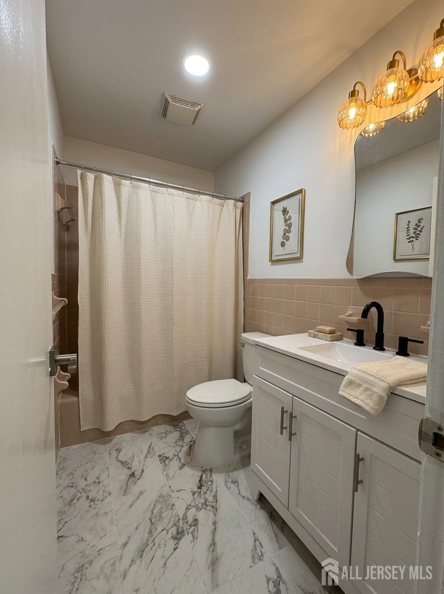 53 North Post Road West Windsor, NJ 08550 - Photo 22 of 36 a bathroom with a sink a toilet and shower