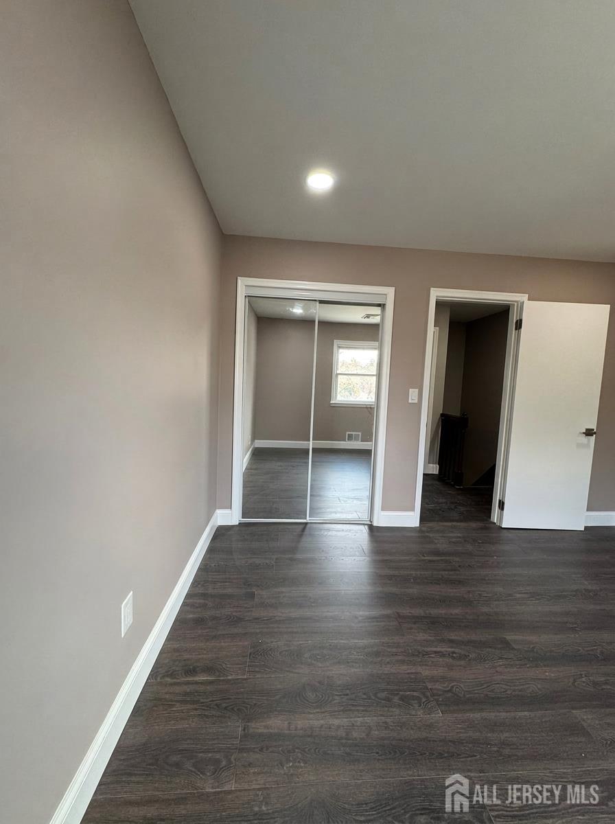53 North Post Road West Windsor, NJ 08550 - Photo 25 of 36 a view of an empty room with wooden floor