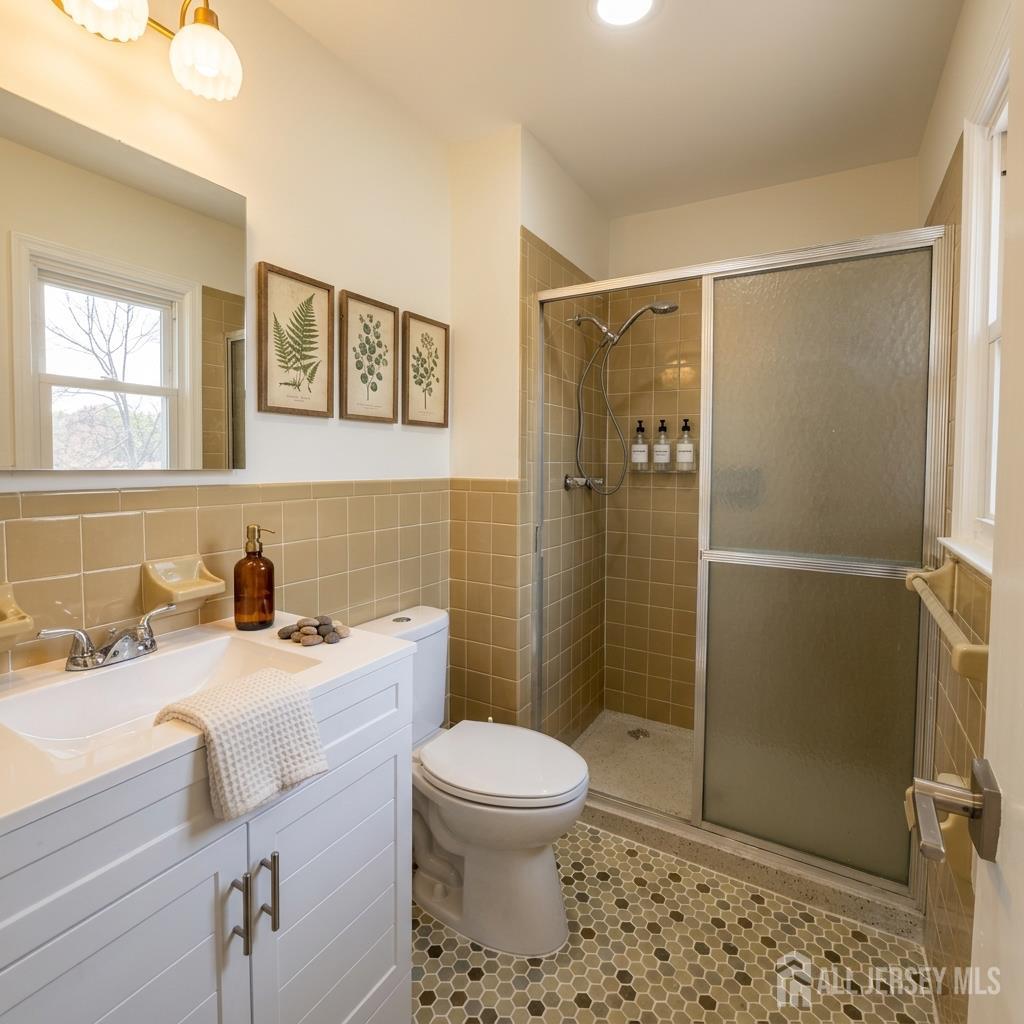 53 North Post Road West Windsor, NJ 08550 - Photo 29 of 36 a bathroom with a sink toilet and shower