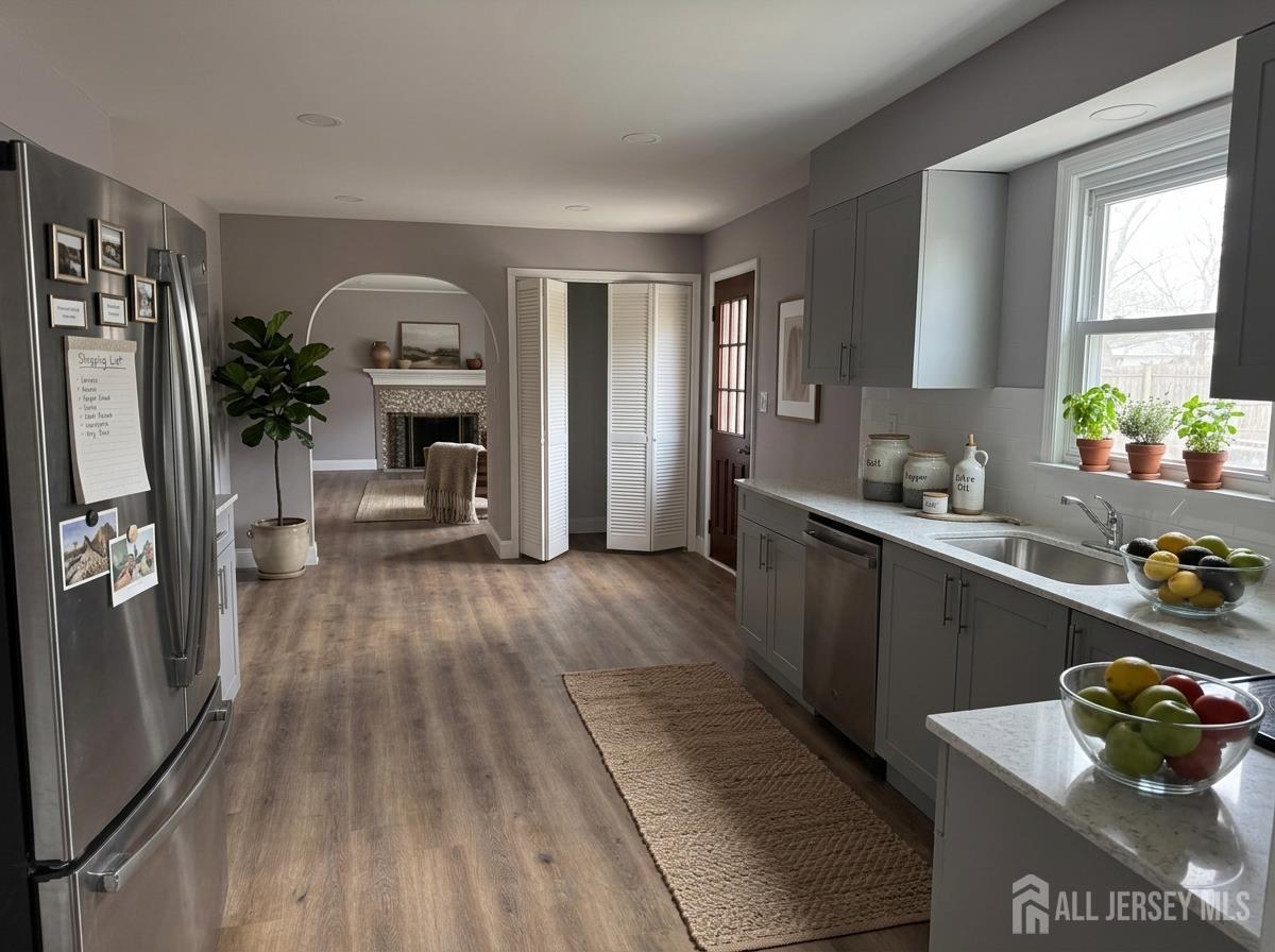 53 North Post Road West Windsor, NJ 08550 - Photo 4 of 36 a kitchen with sink a refrigerator and wooden floor