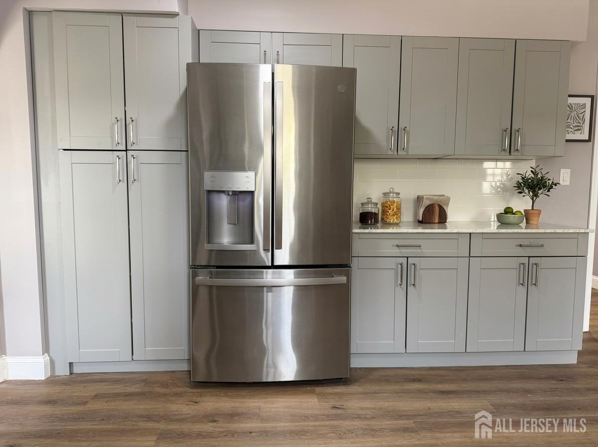 53 North Post Road West Windsor, NJ 08550 - Photo 6 of 36 a kitchen with stainless steel appliances a refrigerator and cabinets