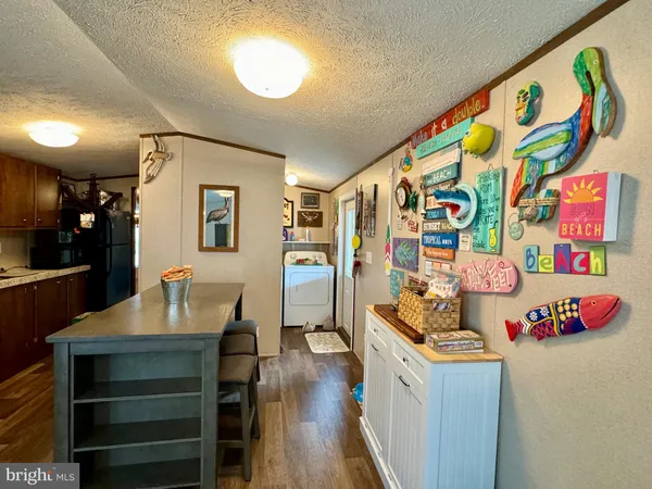 a living room with furniture and painting on the wall