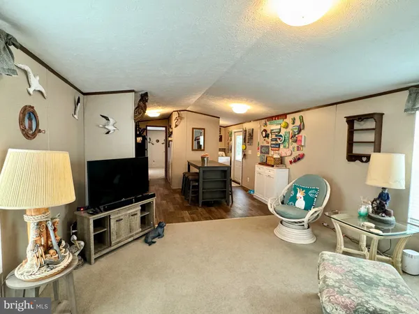 a kitchen with stainless steel appliances a stove a refrigerator and cabinets