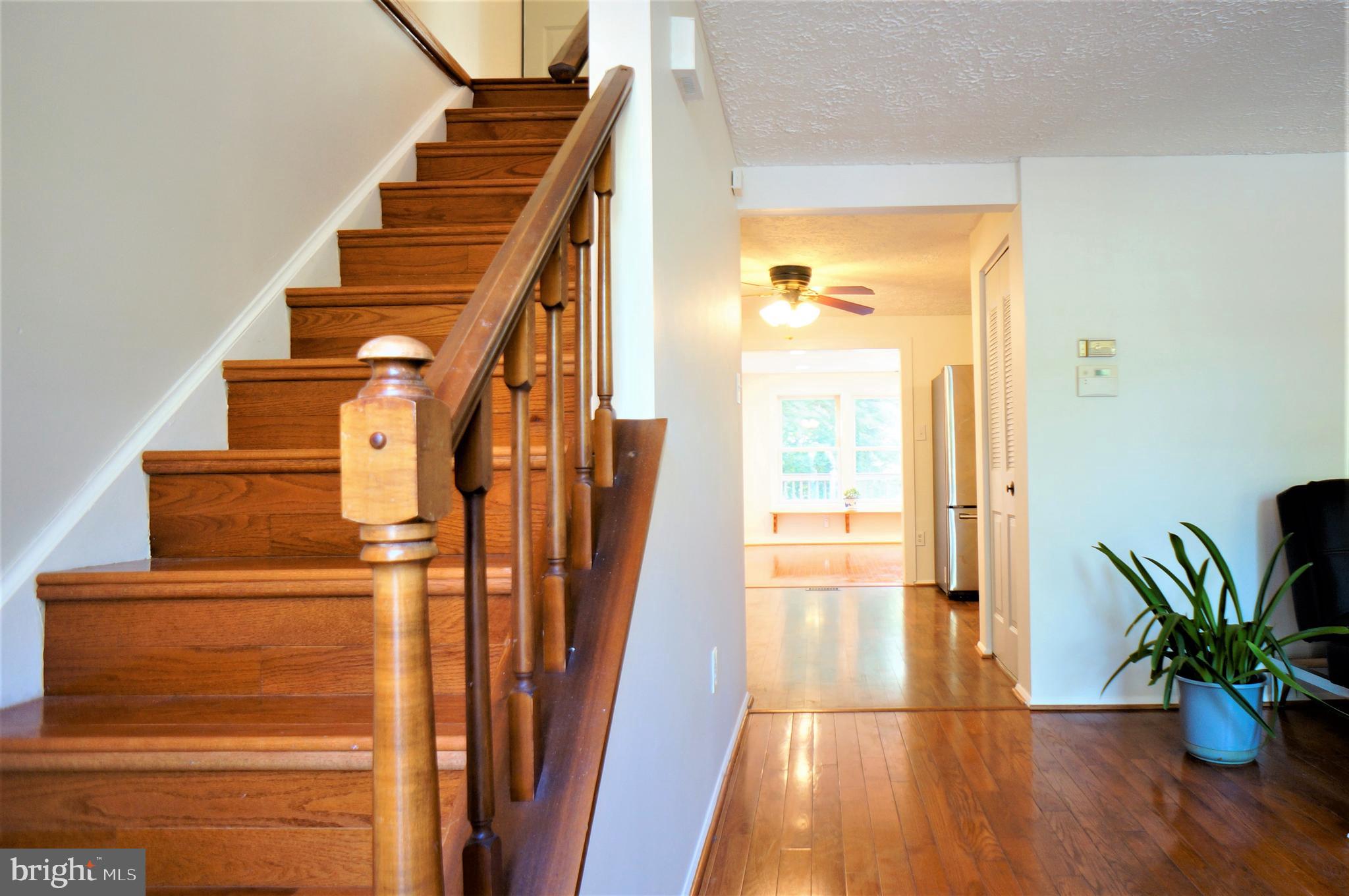 24228 Newbury Road Gaithersburg, MD 20882 - Photo 14 of 34 hardwood stairs going to second floor